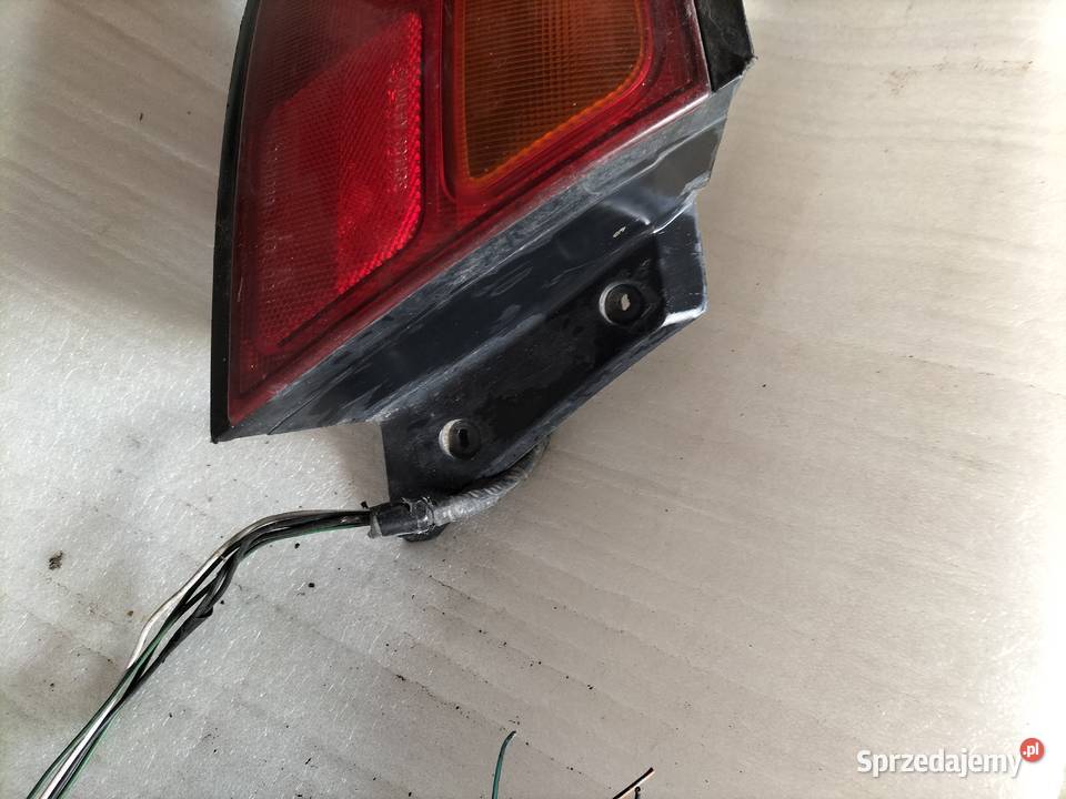 Mazda 323F BA Lampa tylna tył lewa Kamień Kolonia Sprzedajemy pl