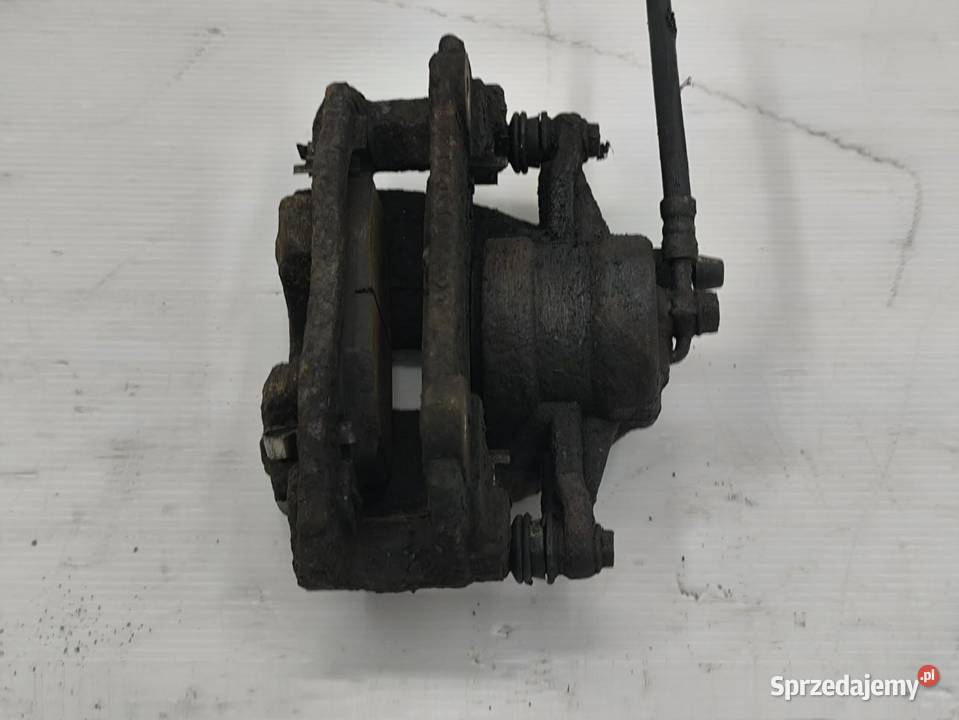 ZACISK LEWY TYŁ TOYOTA AVENSIS II T25 18 VVTI Zaciski i jarzma