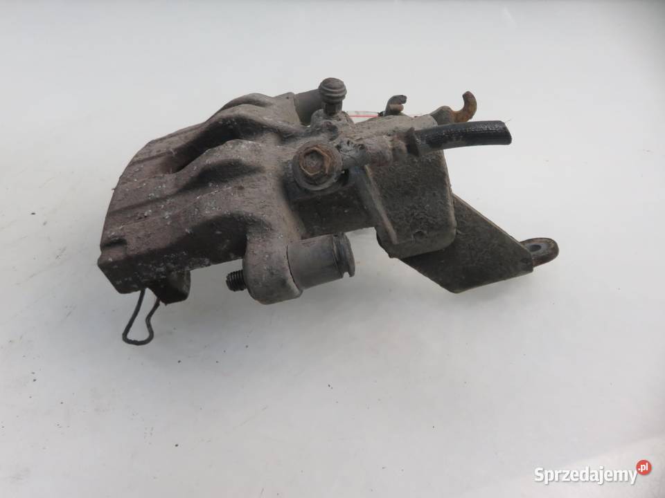 ZACISK LEWY TYŁ NISSAN PRIMERA P12