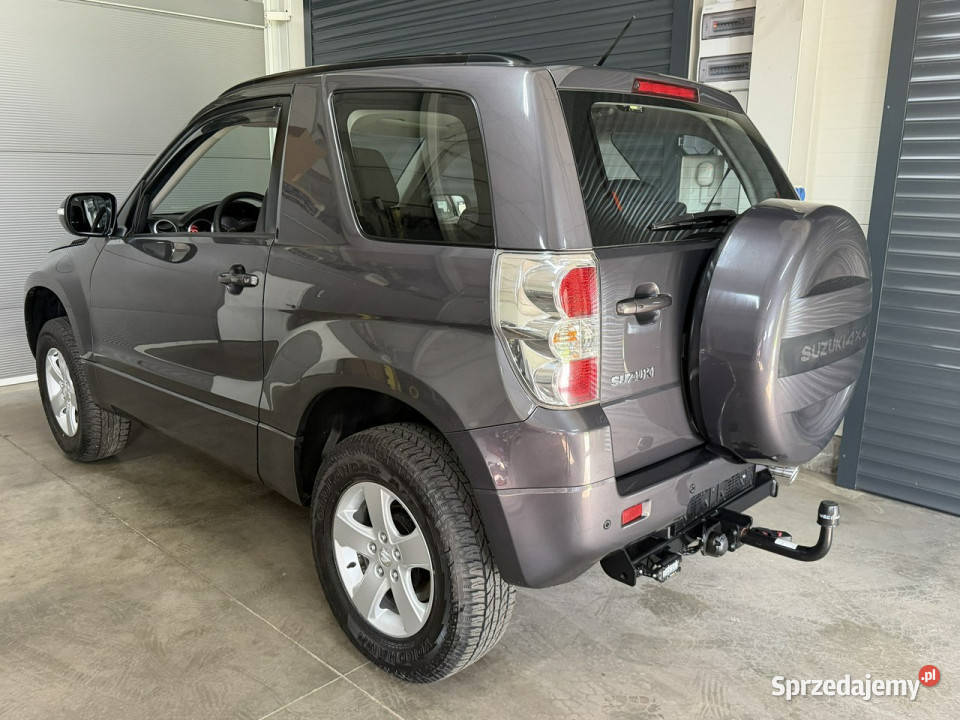 Suzuki Grand Vitara 24 Podniesiona Osłona reflektory ksenonowe Chechło