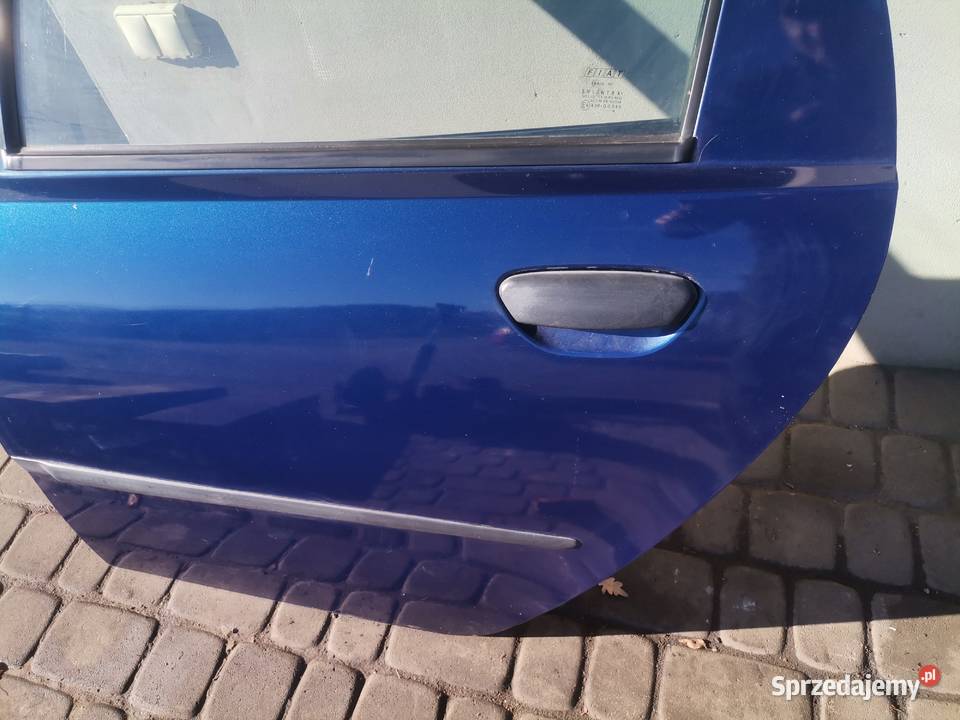 DRZWI LEWY TYŁ FIAT PUNTO 2 5D KOLOR 498 Części samochodowe Nowy Sącz