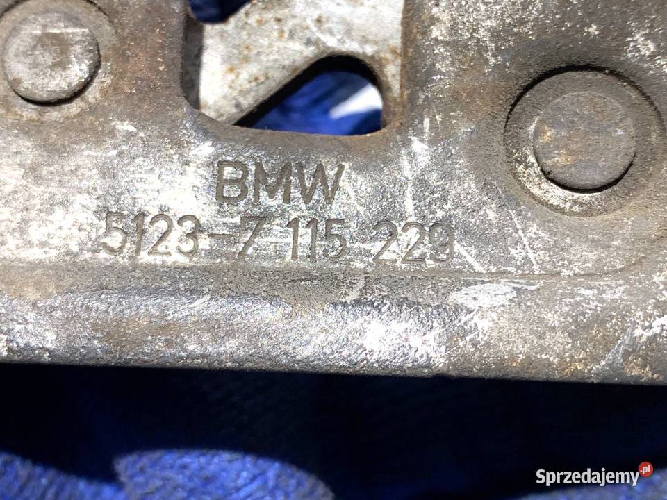 ZAMEK MASKI PRAWY BMW E83 SUV 7115229 0311