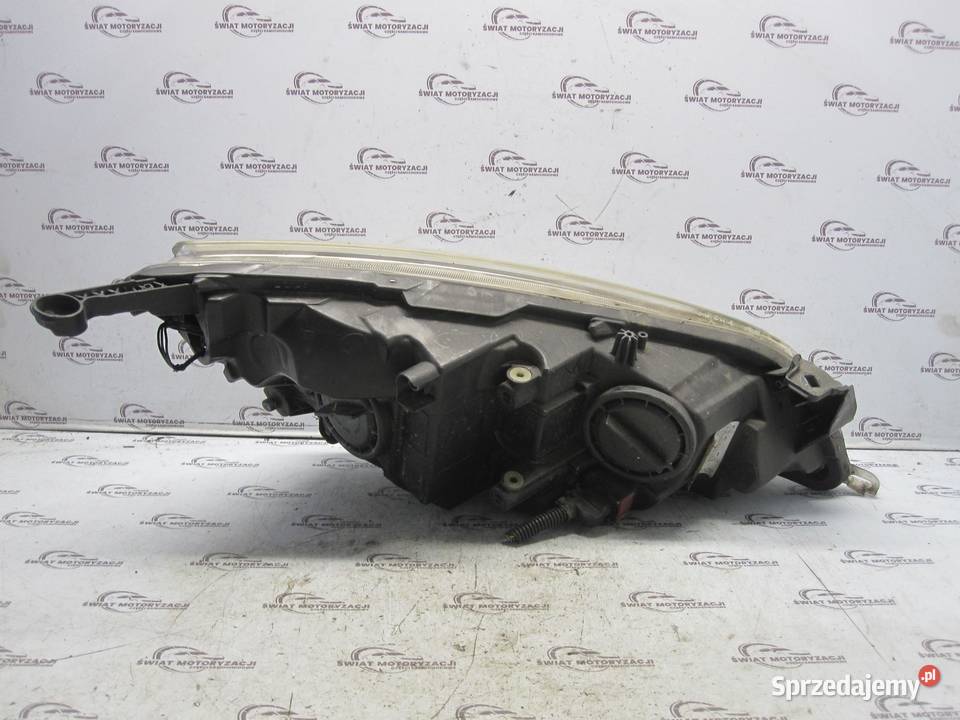 Opel Astra J 2012 lampa lewa przód 13253656