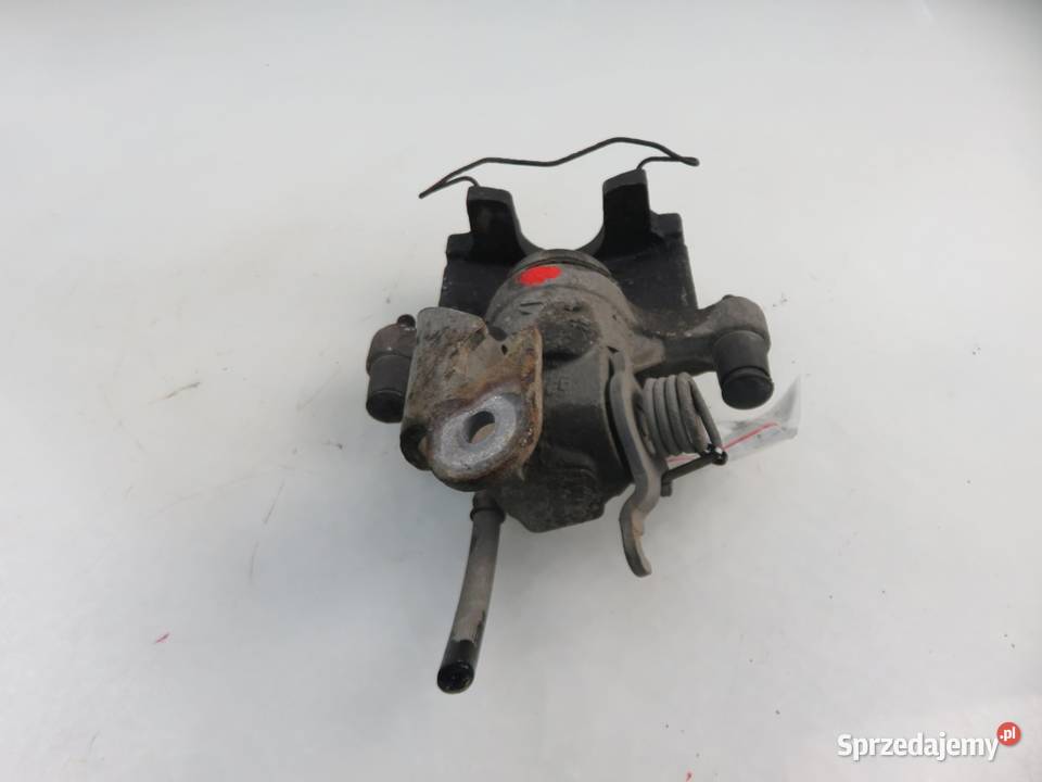 ZACISK PRAWY TYŁ NISSAN PRIMERA P12 Motoryzacja