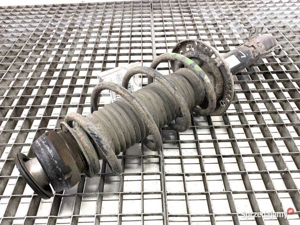 AMORTYZATOR LEWY PRZÓD ZE SPRĘŻYNĄ VW POLO V 12
