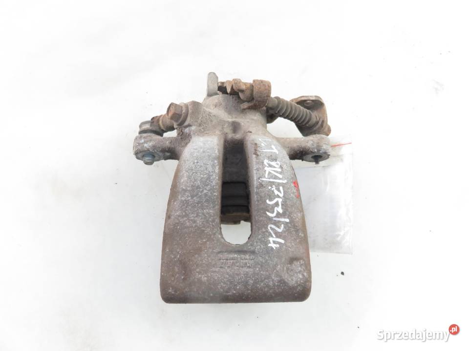 ZACISK LEWY TYŁ OPEL ZAFIRA B 19 CDTI osobowe Części samochodowe