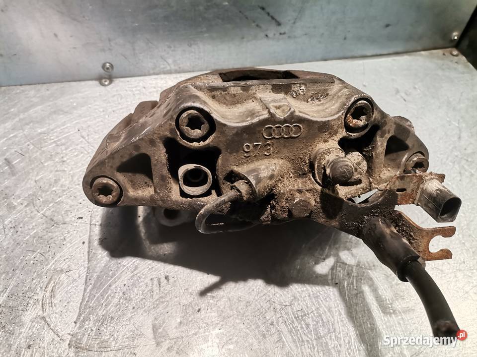 ZACISK 973 LEWY PRZÓD AUDI A4 B6 A6 C5 LIFT POD