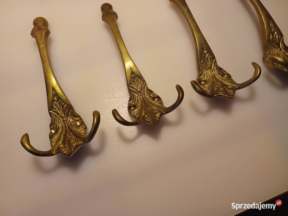 Komplet czterech dużych wieszaków Mosiądz Poznań sprzedam