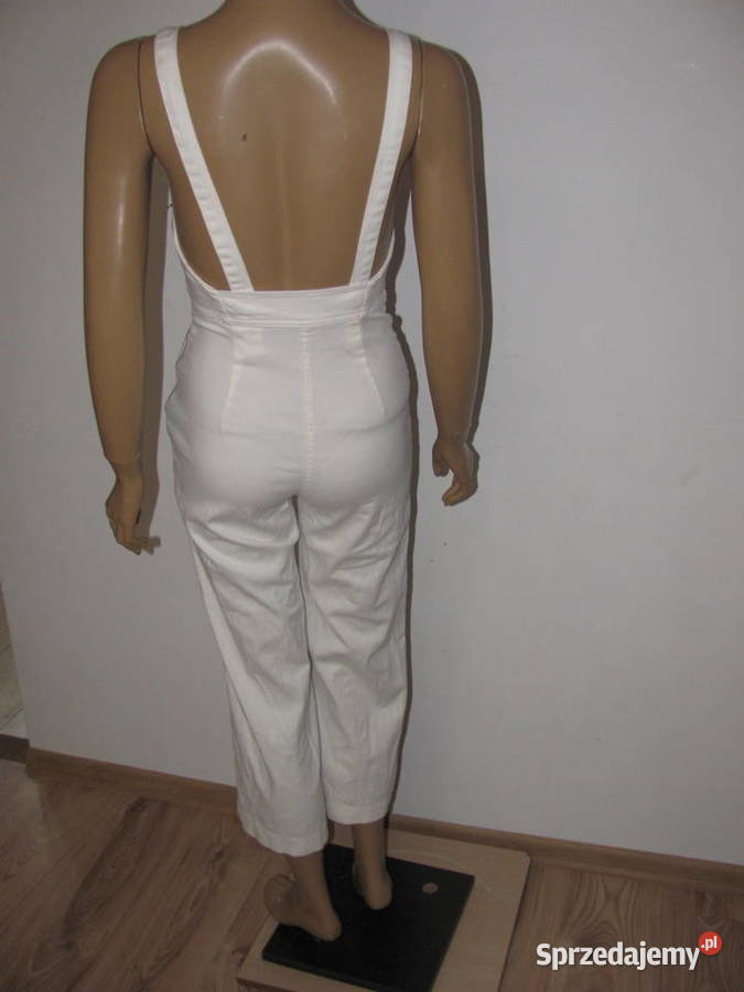 Kombinezon bez rękawów dzwony kremowe spodnie Zamość