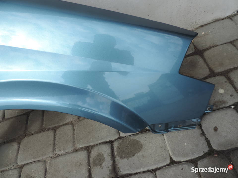 NISSAN PRIMERA P12 BŁOTNIK PRAWY PRZÓD BY4G Rok produkcji 2002 małopolskie