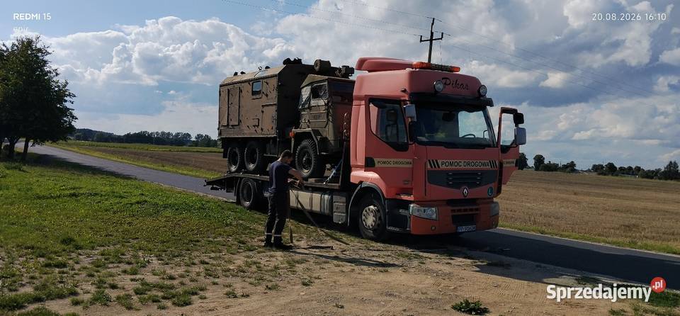Transport pojazdów laweta pomoc drogowa kujawsko-pomorskie Toruń usługi moto