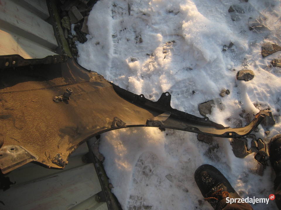 Błotnik przedni prawy Toyota Yaris I 9906 czarny sprzedam