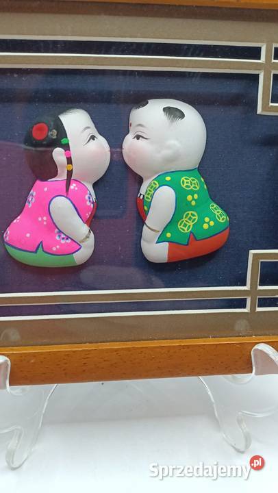 Obraz z chińskimi lalkami z białej glinki