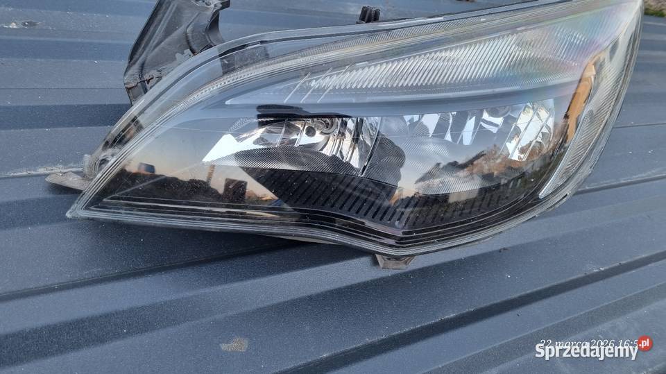 Reflektor Opel Astra J Lampa lewa Piaski