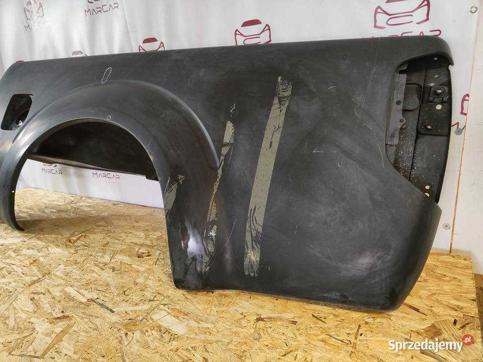 Błotnik Tylny Lewy Nissan Frontier Nowy Oryginał osobowe Błotniki sprzedam