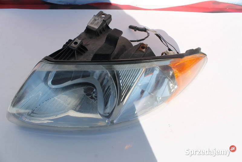Reflektor lewy Dodge Caravan 0107 r Lewe Oświetlenie wielkopolskie Kawnice