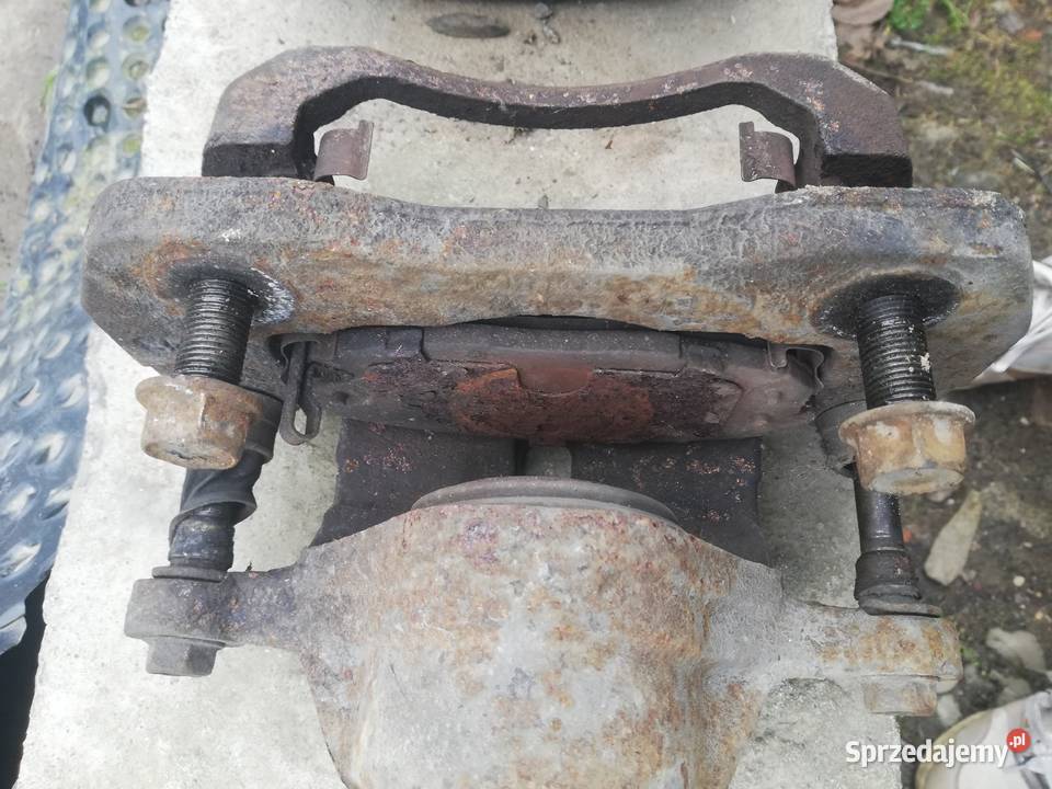 Zacisk przód prawy lewy Kia carens ii 2 osobowe