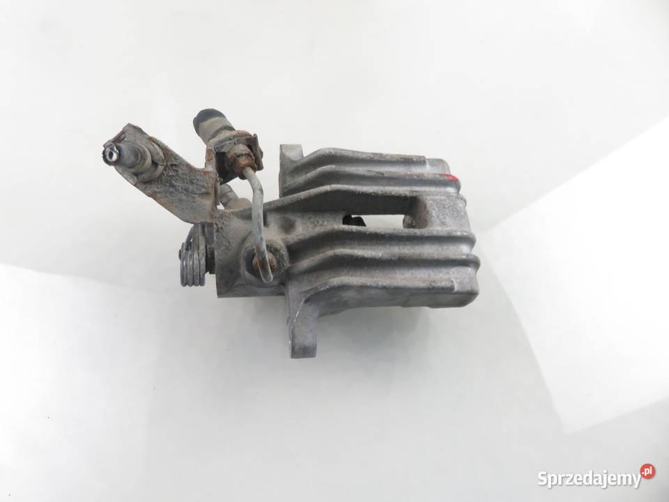 ZACISK LEWY TYŁ VW GOLF V 16 FSI