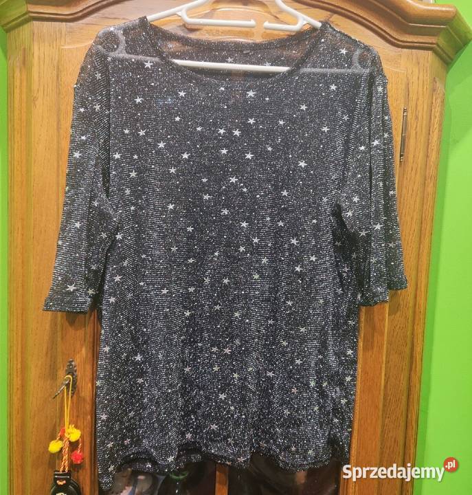 Przeźroczysta bluzeczka połyskująca srebrną