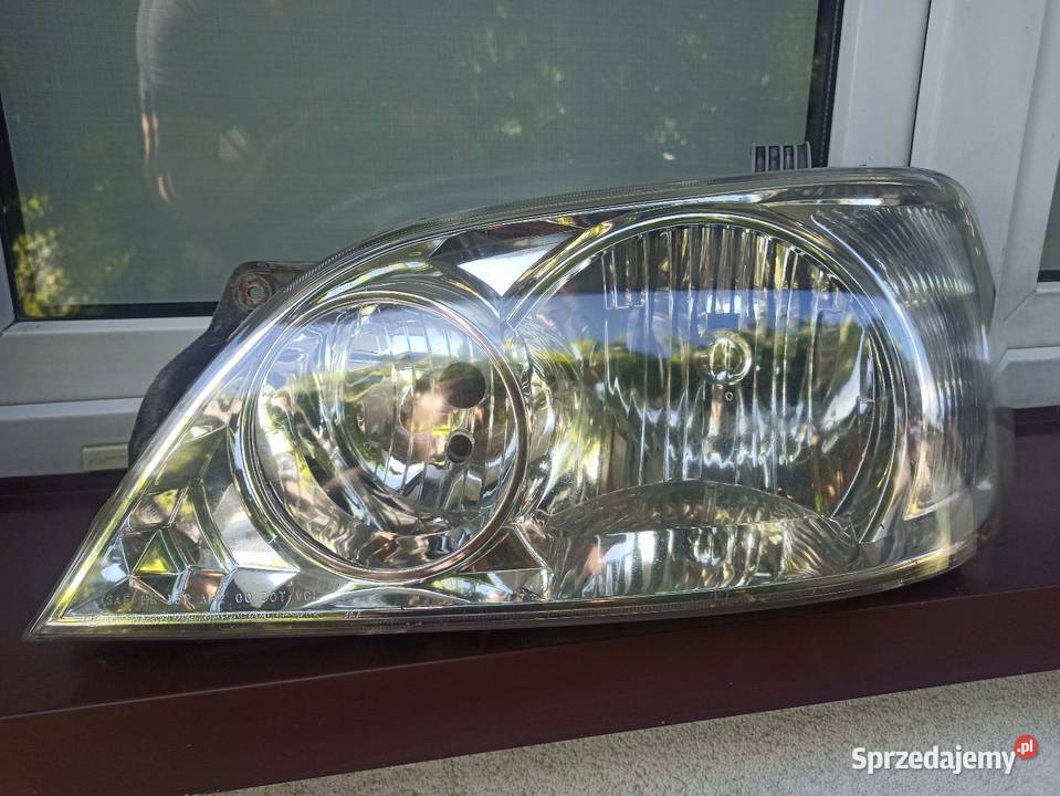 Kia Carnival 1 I lampa przednia lewa reflektor Sieradz
