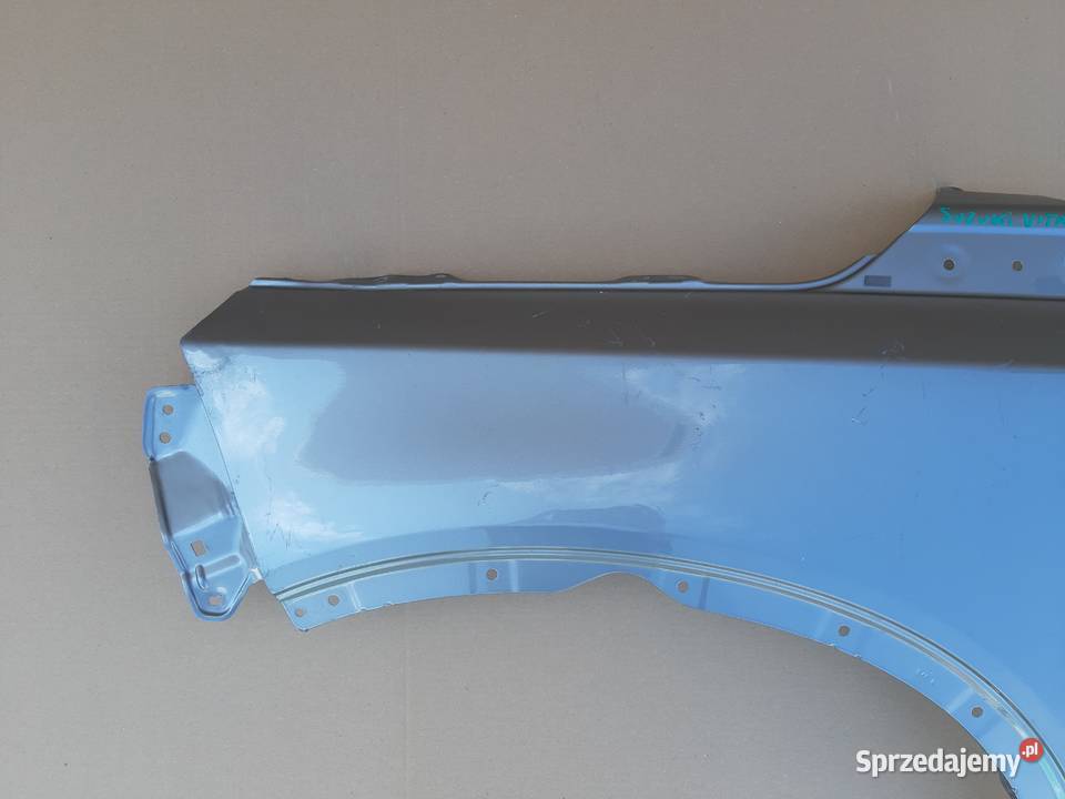 SUZUKI VITARA III BŁOTNIK LEWY PRZÓD Trzciel
