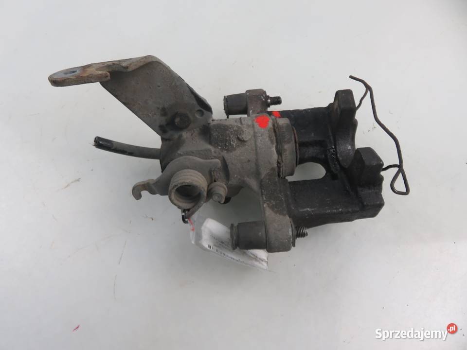 ZACISK PRAWY TYŁ NISSAN PRIMERA P12 Motoryzacja