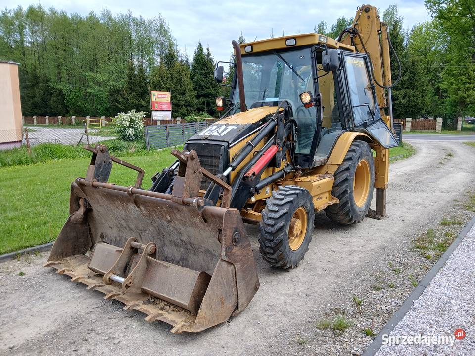 Koparko ładowarka cat 428d 03r Giedlarowa