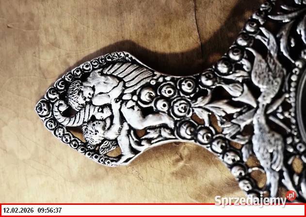 Srebrne sitko do herbaty z motywem puttów1900r Antyki Zgorzelec