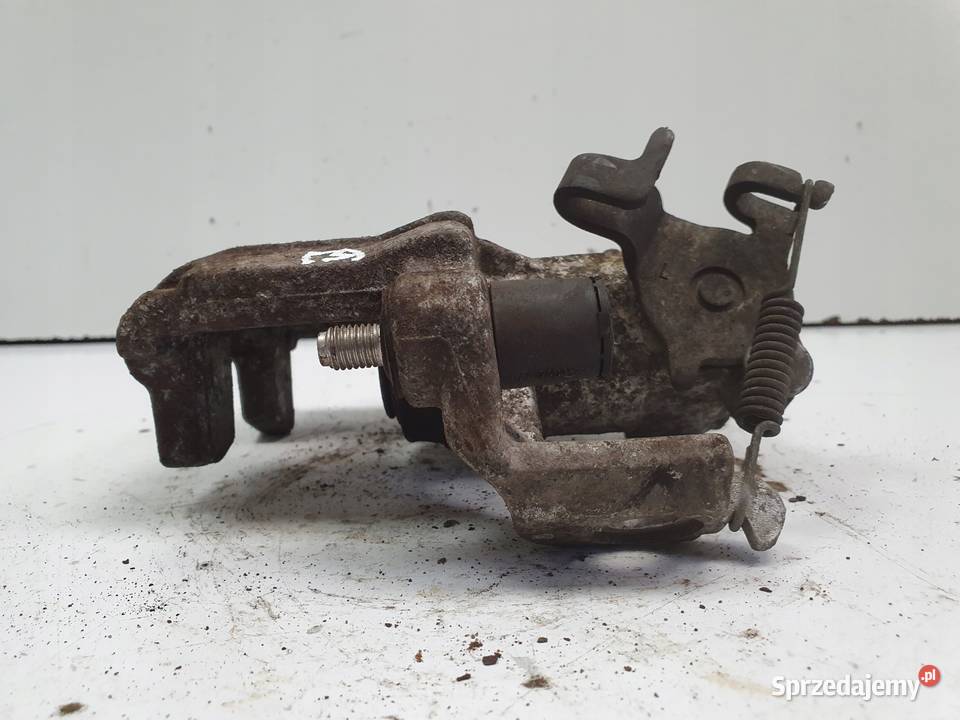 Toyota Yaris IV TYLNY ZACISK HAMULCOWY lewy tył Rudka