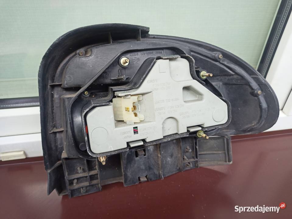 Mazda 121 lampa tył tylna lewa listwa maskująca Sieradz