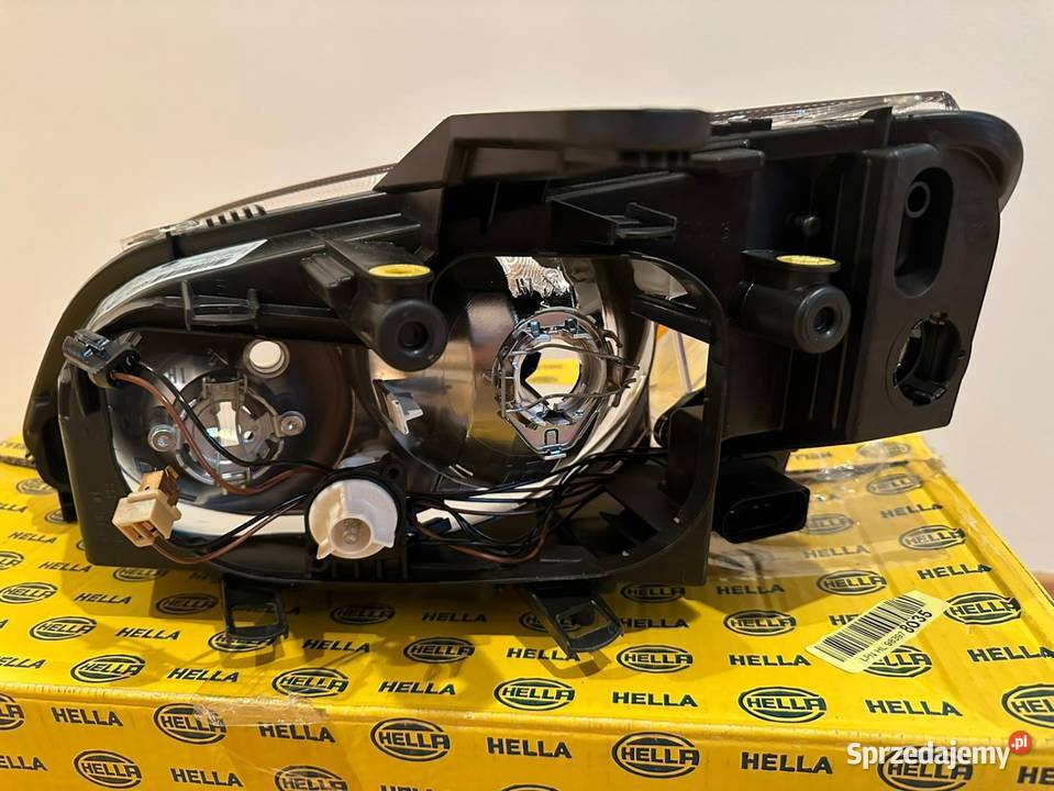Hella nowy reflektor prawy Ford C 1EE 270600181 Grabowskie