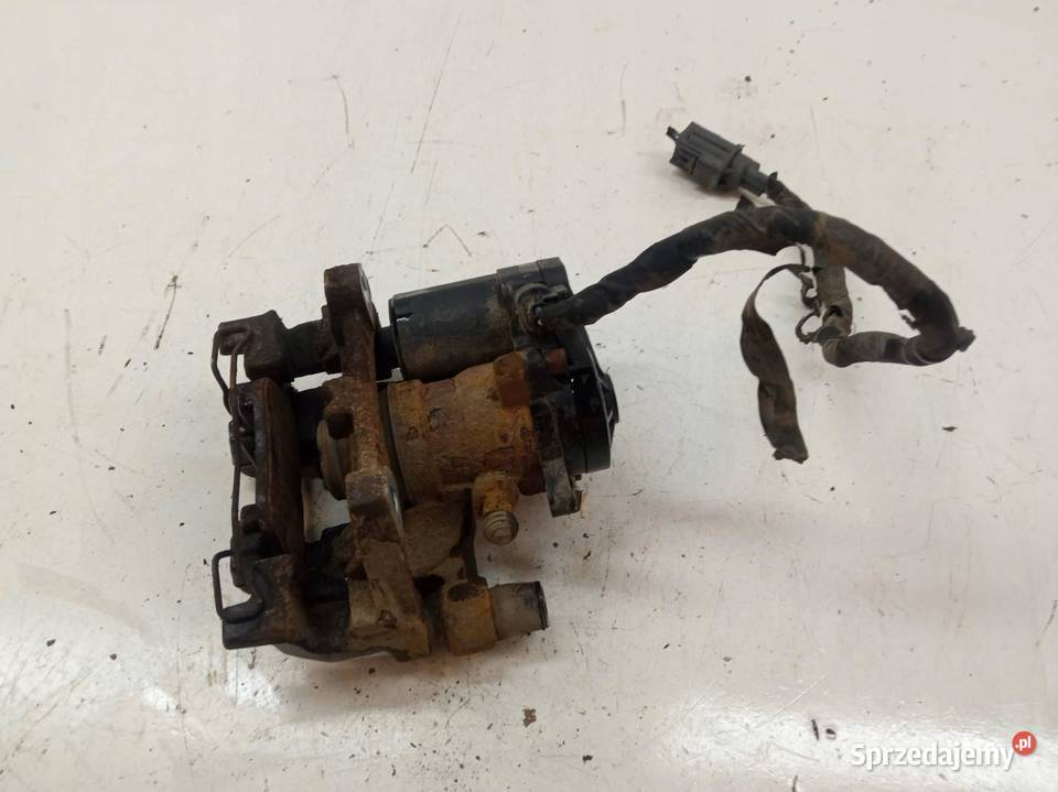 ZACISK HAMULCOWY LEWY TYŁ MONDEO MK5 DG9C2D251K
