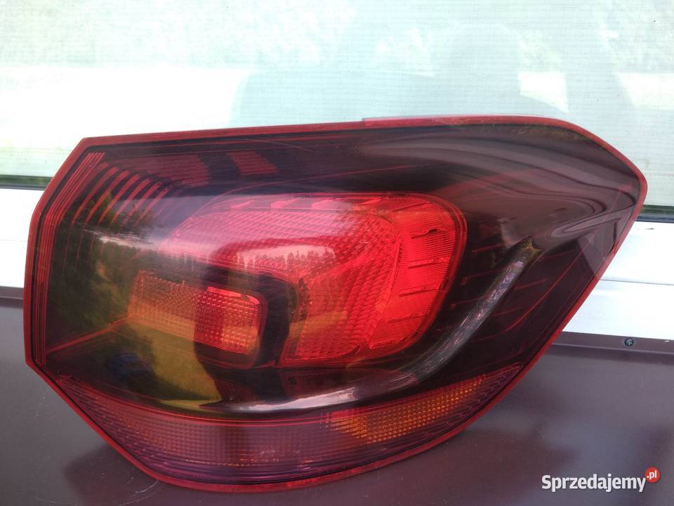 Opel Astra J kombi lampa tył tylna prawa narożna Lampy tylne Sieradz