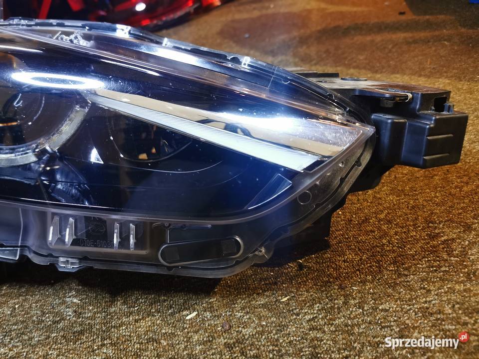 ORYGINALNA Lampa przednia Mazda CX3 OE D10E51030 Pielgrzymka