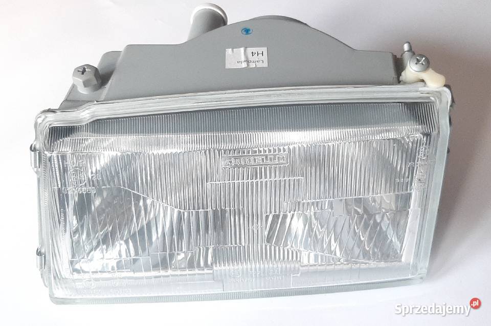 NOWY reflektor lampa przód lewa H4 oryginalna