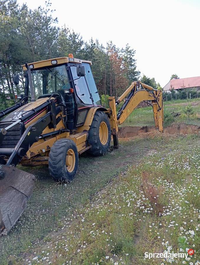 Usługi koparkoładowarką Cat 428D Pustków