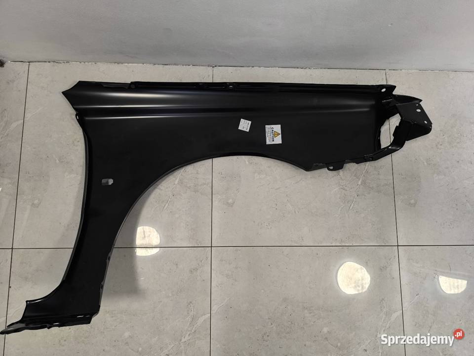 Błotnik Volvo V40 LEWY Przedlift osobowe