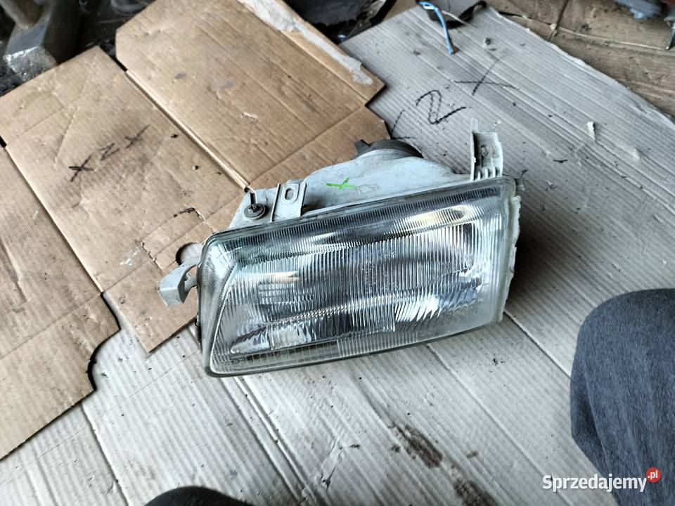 LAMPA PRZÓD PRZEDNIA LEWA REFLEKTOR OPEL ASTRA F Oświetlenie Kamień-Kolonia
