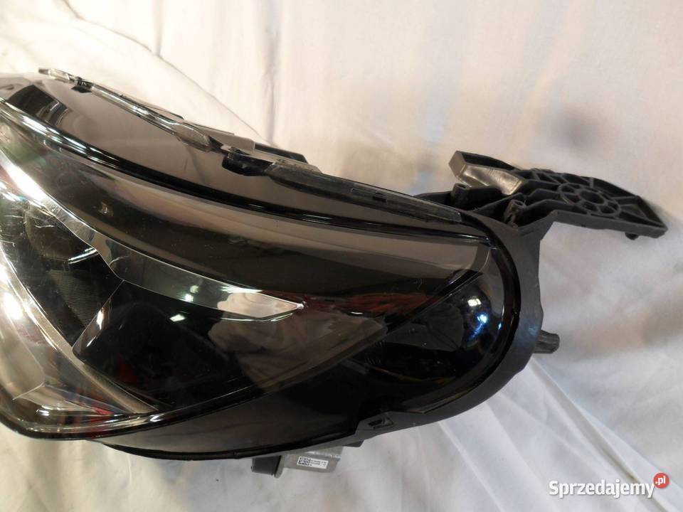 REFLEKTOR PRZÓD STRONA LEWA OPEL CORSA F osobowe Nowy Tomyśl sprzedam