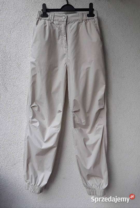 Kremowe spodnie parchute baggy Cropp r32 Długie Odzież damska