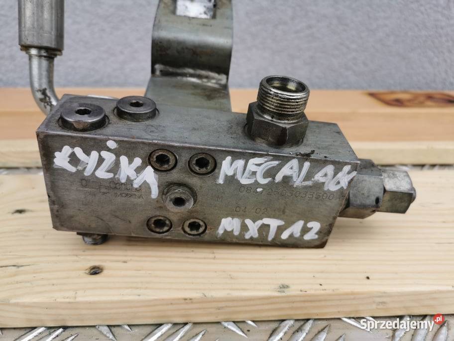 Mecalac 12 MXT Zamek siłownika łyżki Wilkowo sprzedam