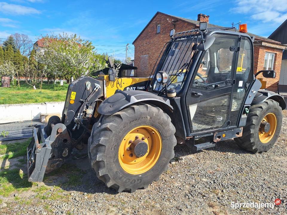 Ladowarka teleskopowa Caterpillar TH407C 2015 Kabina Parczew sprzedam
