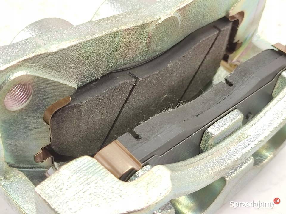 ZACISK HAMULCOWY LEWY PRZÓD KIA CARNIVAL UP GQ