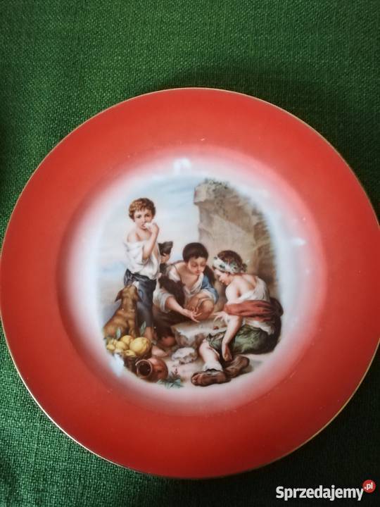 Pomarańczowy sygnowany talerz z historyjką Porcelana i szkło Gorlice