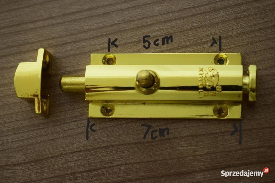 Solidna zasuwka automatyczna w kolorze złotawym