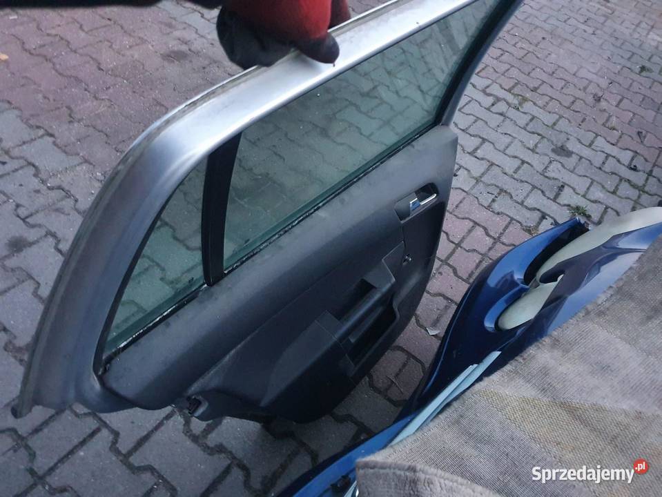DRZWI LEWY TYŁ OPEL ASTRA III H KOMBI SREBRNE