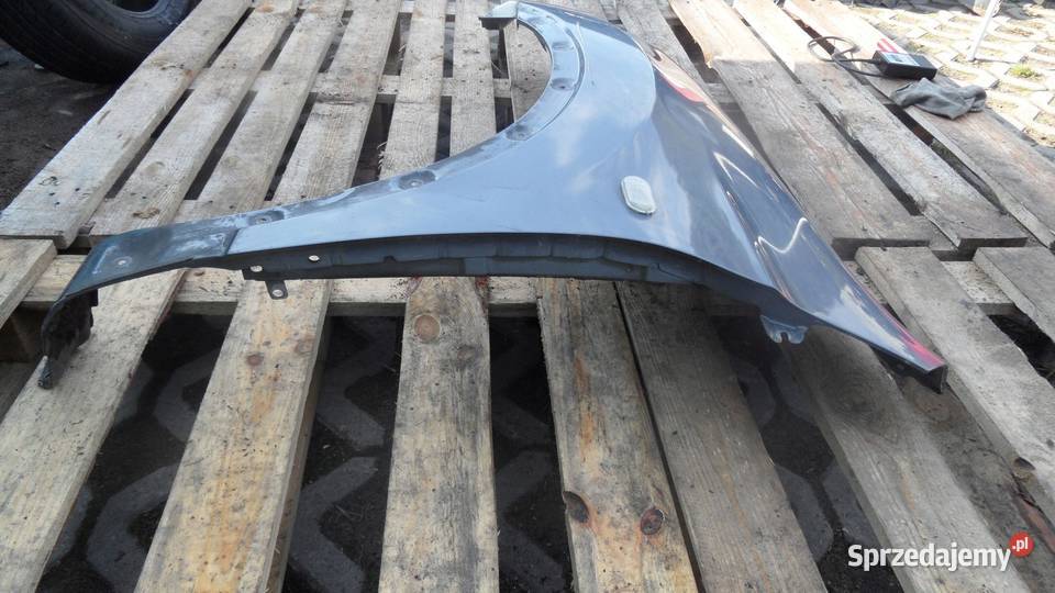 NISSAN QASHQAI I 09r błotnik lewy przód