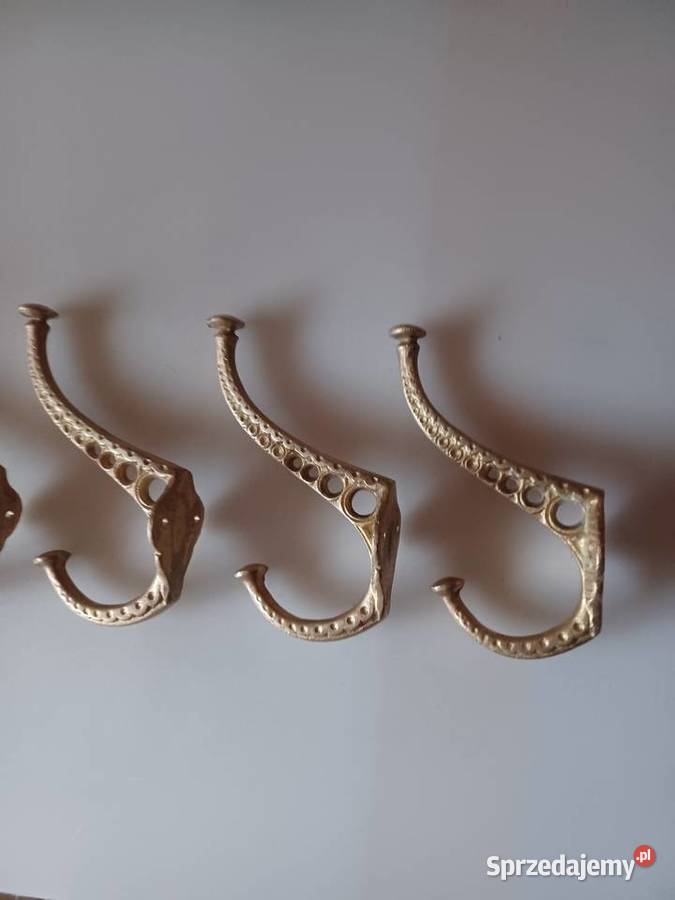 Komplet czterech masywnych wieszaków mosiężnych Pozostałe wielkopolskie Poznań sprzedam