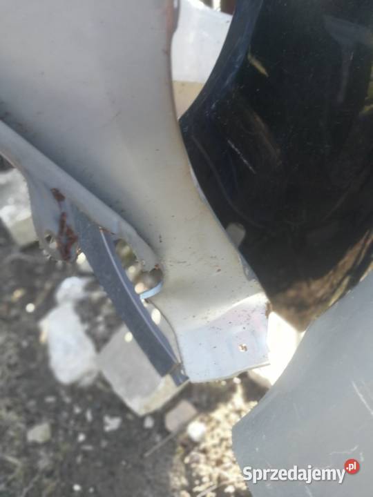 Toyota Yaris 2 2006 błotnik lewy Górno