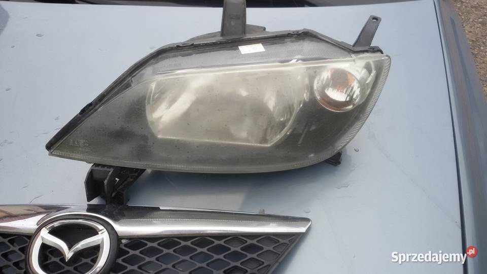 LAMPA PRZEDNIA GRIL MAZDA 2